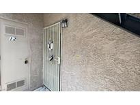 Apartment front door with security gate and the number 12 at 5576 W Rochelle Ave # 12A, Las Vegas, NV 89103