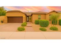 Charming single-story home featuring a well-maintained front yard and an attached two-car garage at 5616 Silver Cascade Ave, Las Vegas, NV 89131