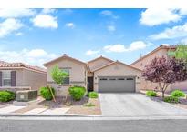 Charming single-story home features a well-maintained front yard and a two-car garage at 9467 Samuel Clemens Ct, Las Vegas, NV 89147