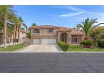Charming two-story home with three-car garage, desert landscaping, and a terracotta roof at 1312 Fragrant Spruce Ave, Las Vegas, NV 89123