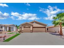 Charming single-story home boasts a stucco exterior, two-car garage, and well-manicured landscaping at 2558 Wiltshire Ave, Henderson, NV 89052