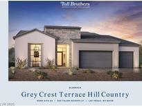Modern home with stone accents, gray garage doors, and professional landscaping at 300 Talon Heights St, Las Vegas, NV 89138