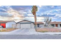 Charming single-story home featuring a two-car garage and desert landscaping at 4145 Plumtree St, Las Vegas, NV 89115