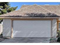 Home's white garage door offering secure parking and additional storage space at 4726 Castle Rock Ct, Las Vegas, NV 89147