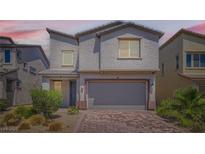 Charming two-story home featuring desert landscaping and a two-car garage at 5947 Wellington Peak Rd, Las Vegas, NV 89148
