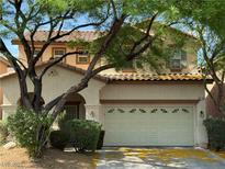 Charming two-story home with a well-maintained front yard and two car garage at 8708 Gateway Glen Dr, Las Vegas, NV 89178