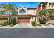 Charming two-story home with a red tile roof, well-maintained landscaping, and an attached two-car garage at 9869 Lime Tree St, Las Vegas, NV 89178
