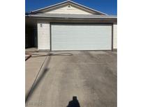 Attached two car garage providing convenient parking and additional storage options at 105 Huntly Rd, Las Vegas, NV 89145