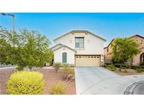 Charming two-story home featuring a two car garage and well-manicured landscaping at 11204 Newbury Hills Ave, Las Vegas, NV 89138