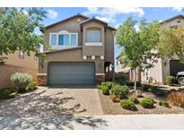 Charming two-story home with a brick driveway and lush landscaping in a quiet neighborhood at 1266 Smokey Valley Ln, Henderson, NV 89002