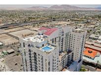 Stunning aerial view of a high-rise condo building with a rooftop pool and city views at 150 Las Vegas Blvd # 2115, Las Vegas, NV 89101