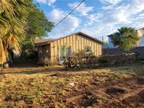 Charming single-story home with rustic wagon wheel accents and mature trees at 165 W Alma Ave, Overton, NV 89040