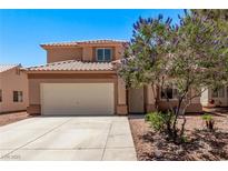 Inviting two-story home with a well-maintained yard and a two-car garage, perfect for suburban living at 2037 Merano Ct, Las Vegas, NV 89123