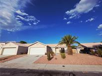 Charming single-story home with desert landscaping and a well-maintained front yard at 4704 Wild Oak Way, North Las Vegas, NV 89031