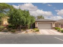 Charming single-story home featuring a two-car garage, desert landscaping, and stone accents at 7126 Mirkwood Ave, Las Vegas, NV 89178