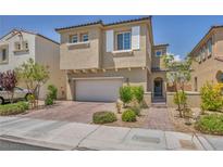 Charming two-story home featuring a two-car garage, stucco exterior, and well-maintained landscaping at 8055 Tank Loop St, Las Vegas, NV 89166