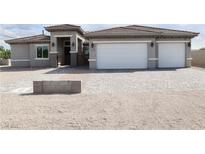 Charming single-story home featuring a two-car garage, gated entry and desert landscaping at 197 E Shelbourne Ave, Las Vegas, NV 89123
