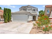 Inviting two-story home with a well-maintained lawn and a two car garage at 2062 Club Crest Way, Henderson, NV 89014