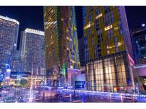 Night view of modern high-rise buildings with vibrant lighting in an urban setting at 3726 Las Vegas Blvd # 3105, Las Vegas, NV 89158