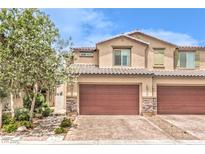 Charming townhome with a two-car garage and manicured front yard at 4212 Juanita May Ave, North Las Vegas, NV 89032