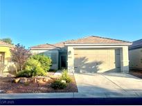 Charming single-story home featuring a two-car garage and desert landscaping at 7029 Bocaire Dr, Las Vegas, NV 89131