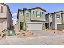 Two-story home featuring a two-car garage, neutral paint and minimal landscaping at 9086 Nostrand Ave, Las Vegas, NV 89148