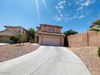 Inviting two-story home features a well-maintained yard and a spacious two-car garage at 11117 Okeefe Ct, Las Vegas, NV 89144