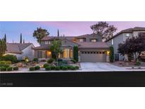 Charming two-story home featuring desert landscaping and a three-car garage at 3535 Coventry Gardens Dr, Las Vegas, NV 89135