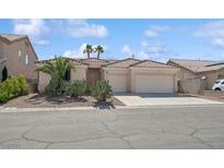 Charming single-story home with desert landscaping and a three-car garage at 4323 Village Spring St, Las Vegas, NV 89147