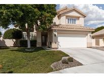 Charming two-story home with a well-manicured lawn and a two-car garage at 7837 Fort Ruby Pl, Las Vegas, NV 89128
