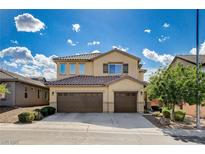 Charming two-story home with three-car garage, tile roof and well-maintained landscaping at 1127 Lake Berryessa St, Henderson, NV 89002