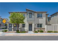 Contemporary two-story home with neutral stucco, landscaping and inviting entryway at 12110 Midnight Pine Rd # 4, Las Vegas, NV 89183