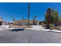 Charming single-story home with a long driveway, mature landscaping, and a well-maintained front yard at 1312 Denarius Cir, Las Vegas, NV 89101
