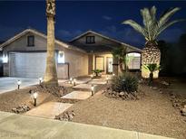 Charming single story home with desert landscaping, stone walkway and cozy front porch with exterior lighting at 1367 Sun Pillars Ave, Henderson, NV 89014