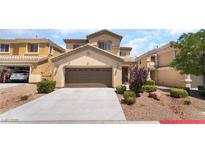 Two-story home featuring a two car garage, neutral color palette, and low maintenance landscaping at 190 Tall Ruff Dr, Las Vegas, NV 89148