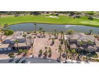 Aerial view of a beautiful vacant lot with golf course and lake views; palm trees dot the property at 38 Grand Miramar Dr, Henderson, NV 89011