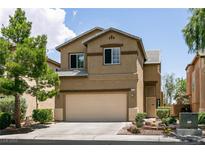 Charming two-story home with a well-maintained yard, two car garage, and desert landscaping at 9712 Red Horse St, Las Vegas, NV 89143