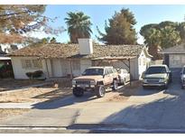 Charming single-story home with a detached carport and mature trees in a quiet neighborhood at 2020 Peyton Dr, Las Vegas, NV 89104