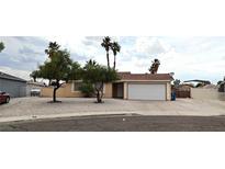 Charming single-story home with a two-car garage and low maintenance landscaping at 275 Las Palmaritas Dr, Las Vegas, NV 89110