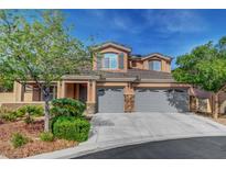 Charming two-story home with landscaped yard, three-car garage and desert landscaping at 3618 Auckland Castle St, Las Vegas, NV 89135