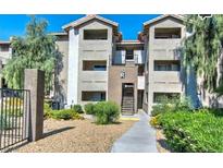 Condo building exterior featuring well-maintained landscaping and a walkway to the entrance at 4200 S Valley View Blvd # 2081, Las Vegas, NV 89103