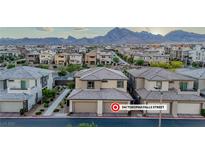 Stunning aerial view of the property, showcasing its prime location and neighborhood with mountain views at 541 Tokopah Falls St, Las Vegas, NV 89138