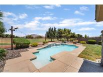 Inviting backyard pool and spa area, perfect for relaxation and enjoying mountain views at 5586 Golden Leaf Ave, Las Vegas, NV 89122