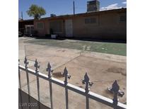 Backyard featuring a concrete surface and fenced enclosure at 2604 Webster St, North Las Vegas, NV 89030