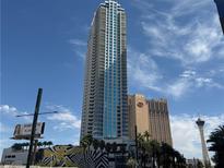 Striking high-rise condo building with expansive windows and balconies against a vibrant blue sky backdrop at 2700 Las Vegas Blvd # 2811, Las Vegas, NV 89109