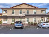 Two-story building featuring assigned covered parking and mature landscaping at 3351 Indian Shadow St # 204, Las Vegas, NV 89129