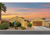 Charming single-story home with desert landscaping and a warm, inviting facade at sunset at 7252 Royal Melbourne Dr, Las Vegas, NV 89131