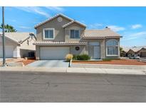 Charming two-story home with a tile roof, low maintenance yard and a two car garage at 7500 Sea Spray Ave, Las Vegas, NV 89128