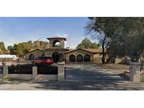 Charming single-story stucco home featuring a gated entrance and spacious driveway at 80 E Levi Ave, Las Vegas, NV 89183