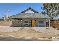 Charming single-story home featuring a welcoming front porch and desert landscaping at 80 E Texas Ave, Henderson, NV 89015